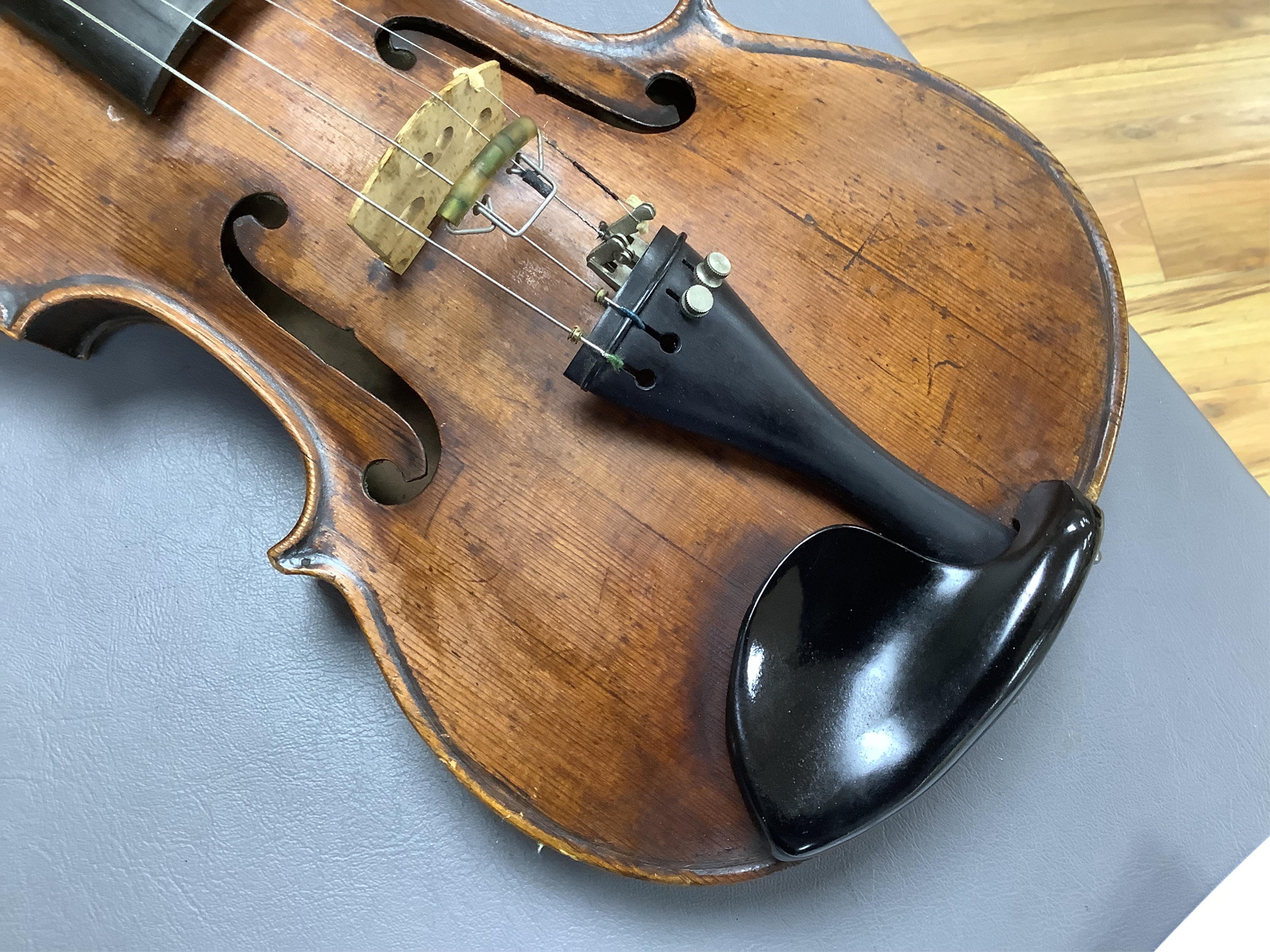 An interesting late 18th century violin, with one piece bird’s eye maple back, unsigned, with two silver fully mounted octagonal bows, one stamped Voight CITES Submission reference, 3XFNUBT7 and Submission reference, RHL